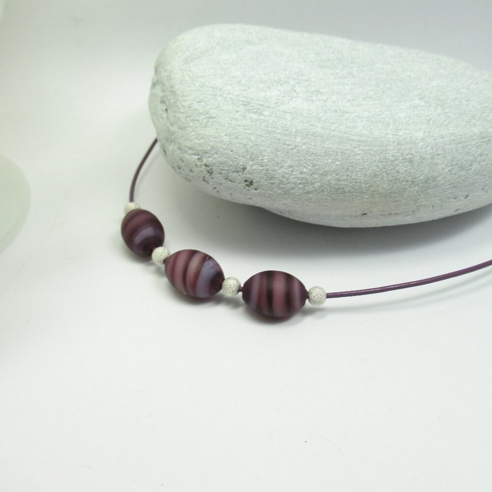 Matte purple Glass beads on leather